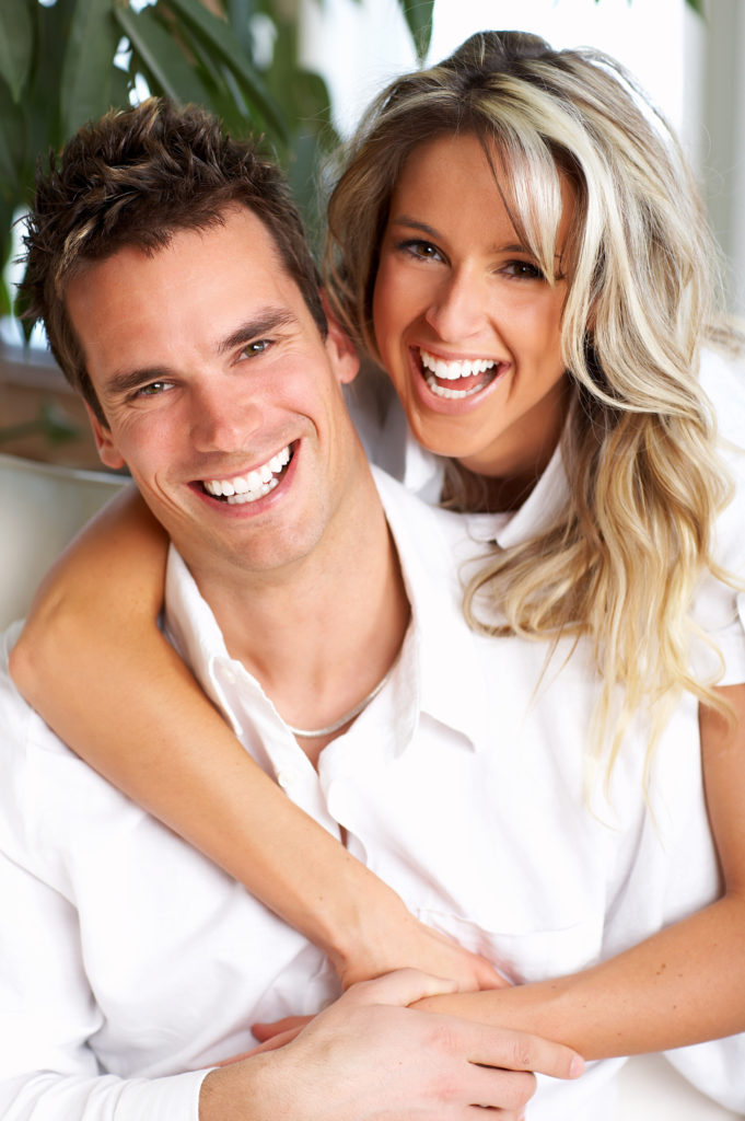 Young love couple smiling in the comfortable apartment